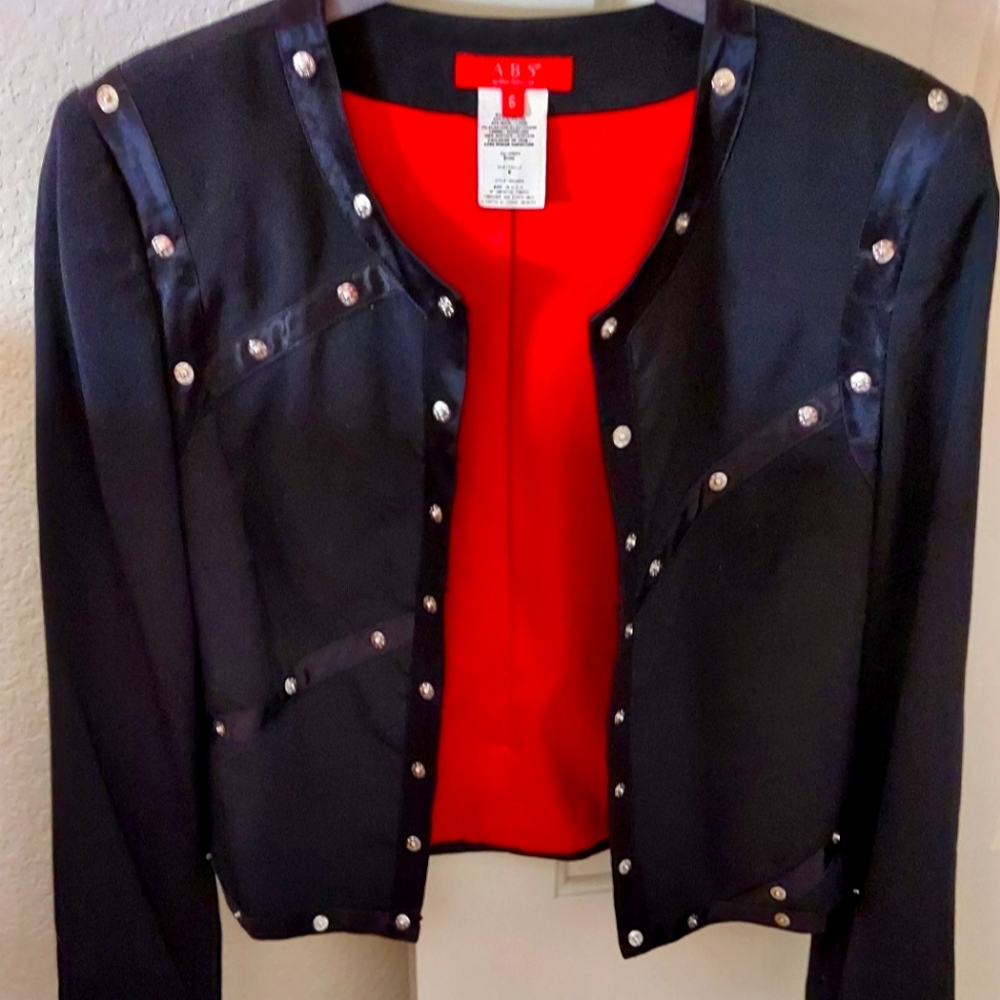 ABS JACKET SIZE 6 BLACK WITH RED LINING AND SILVER DECORATIVE SNAPS